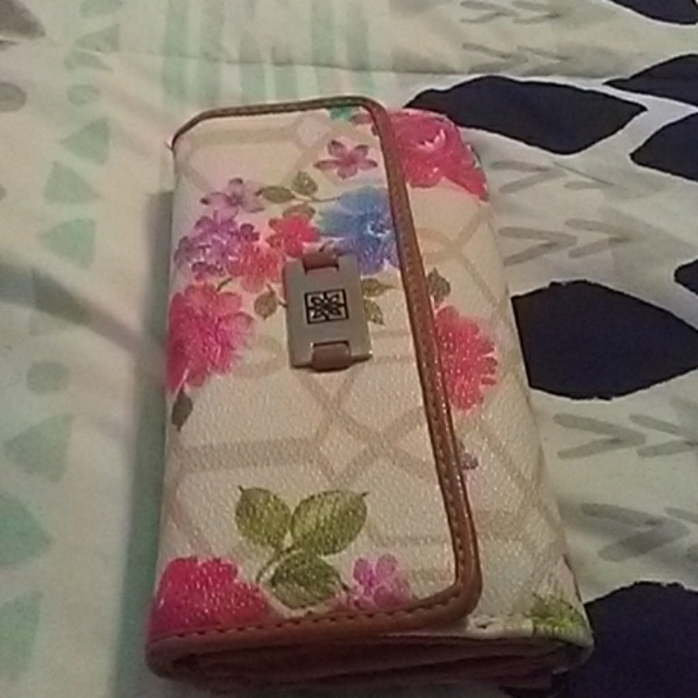 2 wallets one floral one tribal print some flaws s